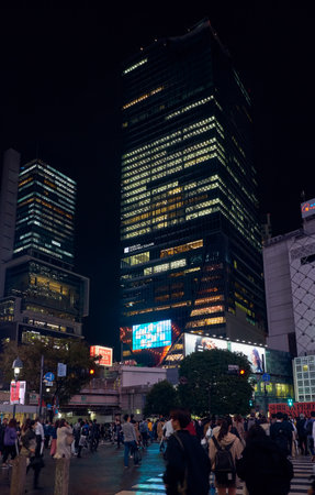 Tokyo, Japan - October 25, 2019: The night view of one of the busiest crossing in the world, Shibuya Crossing or Shibuya Scramble Crossing in front of the Shibuya Station. Tokyo. Japanのeditorial素材