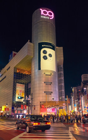 Tokyo, Japan - October 25, 2019: The night view of one of crossing of Shibuya shopping district surrounded by bright advertisements and banners. Tokyo. Japanのeditorial素材