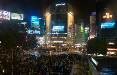 Tokyo, Japan - October 25, 2019: The night view of one of the busiest crossing in the world, Shibuya Crossing or Shibuya Scramble Crossing in front of the Shibuya Station. Tokyo. Japanのeditorial素材