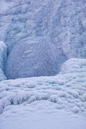 Photo of frozen waterfall on river Pescherka in winter season. Siberia, Russia
