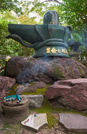 Nagoya, Japan - October 20, 2019: The bronze Shiva Linga in Toganji temple. The symbol of lingam-yoni, the union of the feminine and the masculine in Buddhist mythology. Nagoya. Japanのeditorial素材