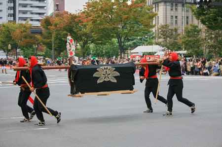 Kyoto, Japan - October 22, 2007: Nagamochi luggage bearers who would march in front the procession to provide information and entertainments at Jidai Festival. Kyotoのeditorial素材
