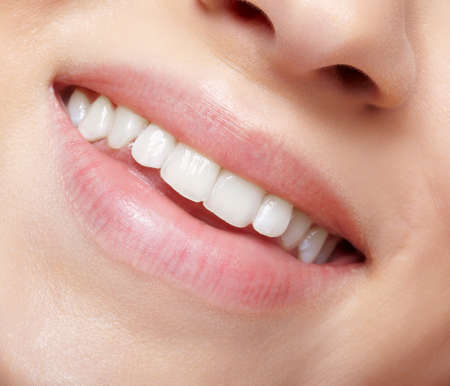 Human mouth and nose. Closeup macro portrait of young female part of face with no makeup.の写真素材