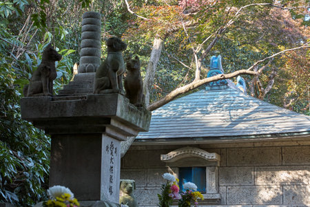 Nagoya, Japan - November 20, 2007: An altar with the statues of dogs and cat at the area which is dedicated to the dead pets near the pet cementery at Toganji temple. Nagoya. Japanのeditorial素材