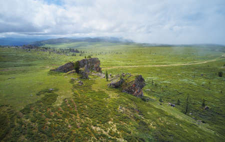 Morning fog in the mountains. Altai, Siberia.