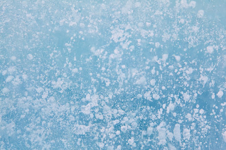 Texture of winter ice surface. Blue natural ice background.の写真素材