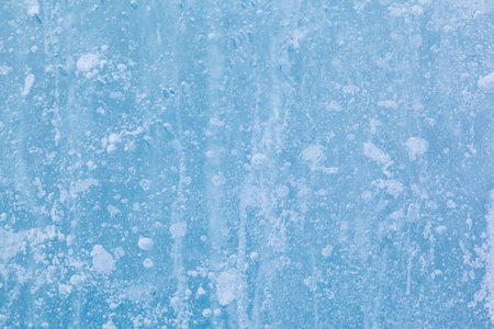 Texture of winter ice surface. Blue natural ice background.の写真素材