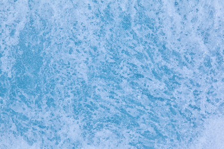 Texture of winter ice surface. Blue natural ice background.の写真素材