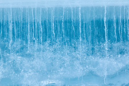 Texture of winter ice surface. Blue natural ice background.の写真素材