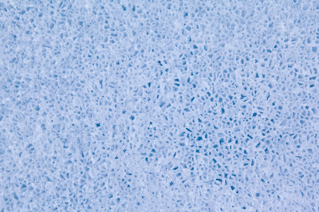 Texture of winter ice surface in the form of polygonal patterns. Blue natural ice background.の写真素材