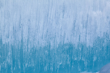 Texture of winter ice surface. Blue natural ice background.の写真素材
