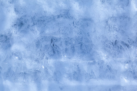Texture of winter ice on a stone cliff. Blue natural ice background.の写真素材