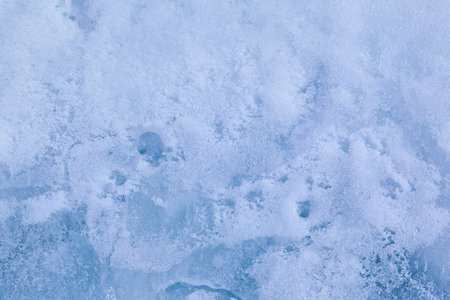 Texture of winter ice surface. Blue natural ice background.の写真素材