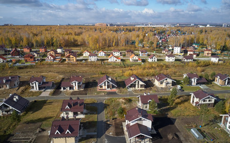 Aerial photo of scientific cottage village Sigma. Beautiful autumn country landscape from above. Novosibirsk, Siberia, Russia.の写真素材