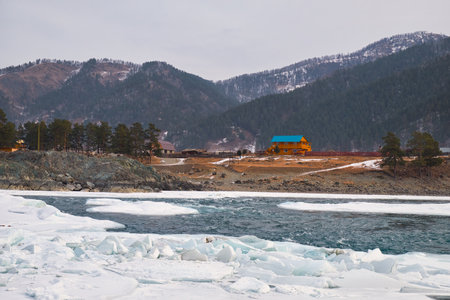 Rapids of Altai river Katun with banks covered by ice and snow in winter season near Elekmonar settlement, Siberia, Russiaの写真素材