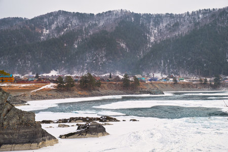 Rapids of Altai river Katun with banks covered by ice and snow in winter season near Elekmonar settlement, Siberia, Russiaの写真素材
