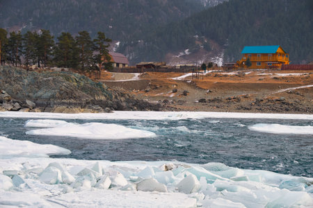 Rapids of Altai river Katun with banks covered by ice and snow in winter season near Elekmonar settlement, Siberia, Russiaの写真素材