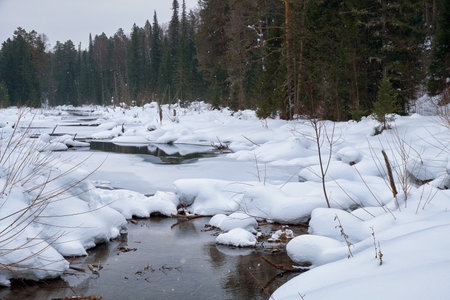 Small creek in Altai village Ust'-Lebed' in winter season. Siberia, Russiaの写真素材