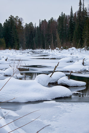 Small creek in Altai village Ust'-Lebed' in winter season. Siberia, Russiaの写真素材