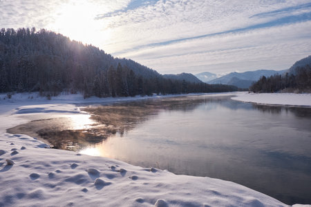Altai river Biya in winter season. Banks of river are covered by ice and snow. Altai, Siberia, Russiaの写真素材