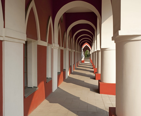 The building with columns and arches.