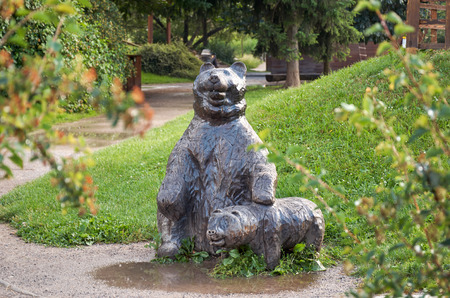 Bear sculpture and a small teddy bear in the Prague zooの写真素材