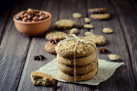 Oatmeal cookies with nuts on wooden tableの写真素材