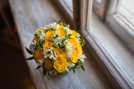Beautiful wedding bouquet  on the windowsill backgroundの写真素材