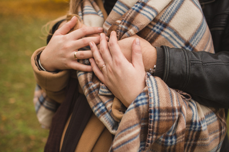 Attractive couple hugging in the park, close up.の写真素材