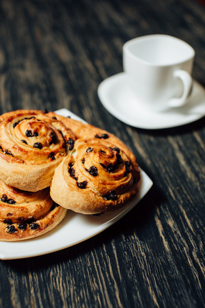 Delicious homemade bakery with chocolate on dark wooden table.の写真素材