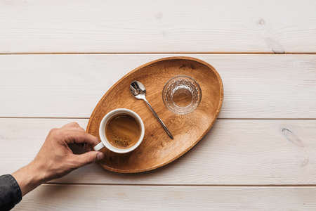 Espresso coffee americano on wooden background in cup. Espresso Americano in a glass of coffee.の写真素材