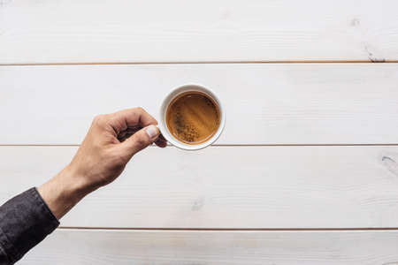Americano coffee brewing in a teapot a cup. Coffee in cup on wooden.の写真素材
