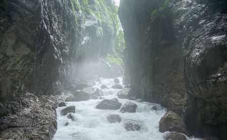 mountain river on a background of rocksの写真素材
