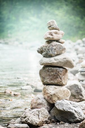 Stack of zen stones on nature background, concept of balance and harmonyの写真素材