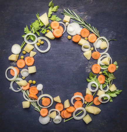 Colorful various of organic farm vegetables lined frame on wooden rustic background top view place for text vegetarian concept frameの写真素材