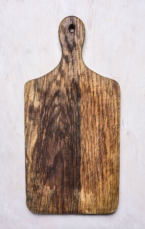 vintage old cutting board on a white background border ,place for text on wooden rustic background top view close upの写真素材