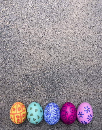 colorful decorative painted eggs for Easter on a granite background top view close upの写真素材