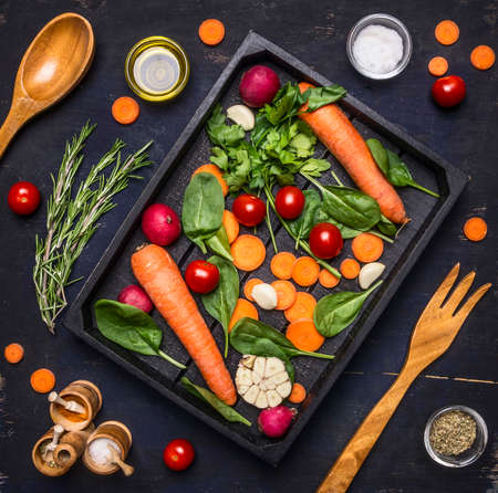 Fresh delicious ingredients for healthy cooking or salad making on rustic background, top view Diet or vegetarian food conceptの写真素材