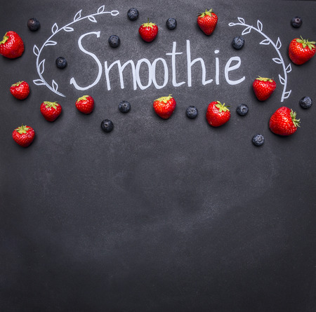 Fresh organic Smoothie ingredients. Superfoods and health or detox diet food concept. concept cooking smoothies from fruit and vegetables, on the chalk board, with space for textの写真素材