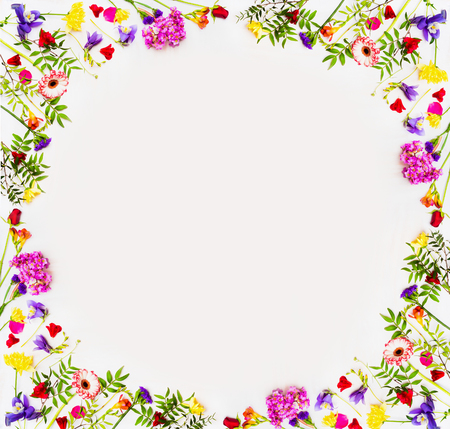 Lovely springtime flowers background with colorful blossom, top view, frame. Springtime and nature concept, frame place for textの写真素材