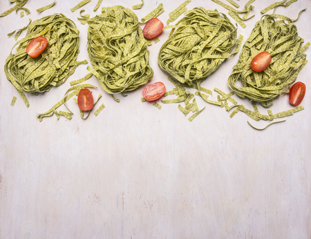 healthy foods, cooking and vegetarian concept green pasta with cherry tomatoes, spices and Champignon,, Border, place for textの写真素材