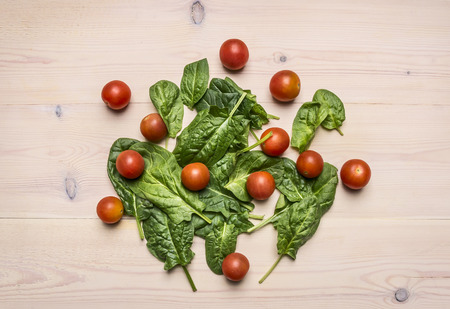 concept of cooking vegetarian food, useful, vitamin-rich vegetables and fruits, salad, bell peppers, lime, cherry tomatoes, lime, lined on a wooden rustic backgroundの写真素材