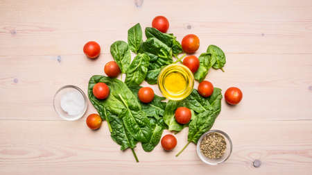 Fresh delicious ingredients for healthy cooking or salad making on rustic background, top view. Diet or vegetarian food concept.の写真素材