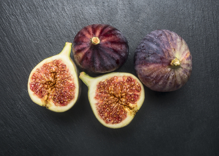 appetizing Figs Slice in light on dark background , top viewの写真素材