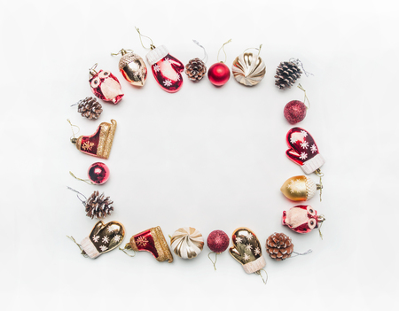 different Christmas toys and ornaments for christmas, lined with a rectangular frame on a white background, space for text, top viewの写真素材