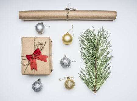 Christmas flat lay composition, wrapping paper, gift, pine branch and toys, top viewの写真素材