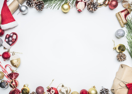 Christmas composition in a frame lined with Christmas decorations and toys, space for textの写真素材