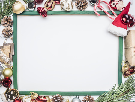 Christmas composition in a frame lined with Christmas decorations and toys, space for textの写真素材