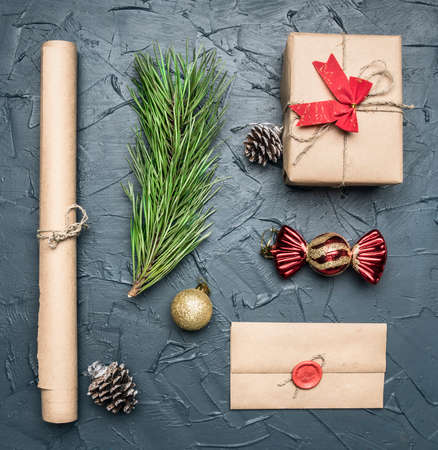 Christmas flat lay gift in packing, paper, envelope with print, Christmas tree toyの写真素材