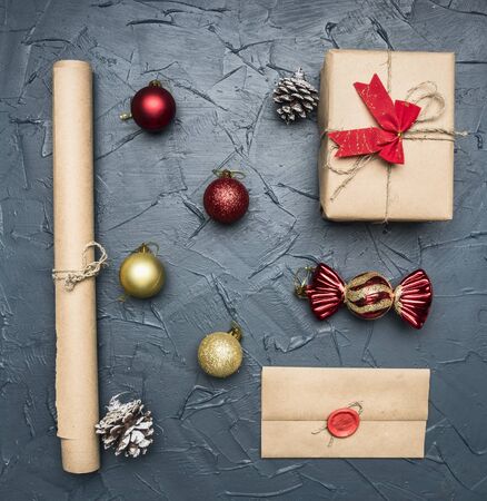 Christmas flat lay gift in packing, paper, envelope with print, Christmas tree toyの写真素材